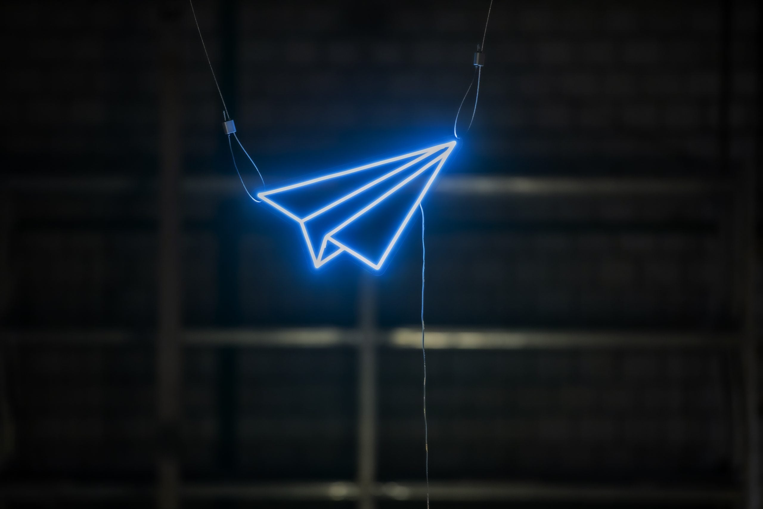 Paper plane neon sign